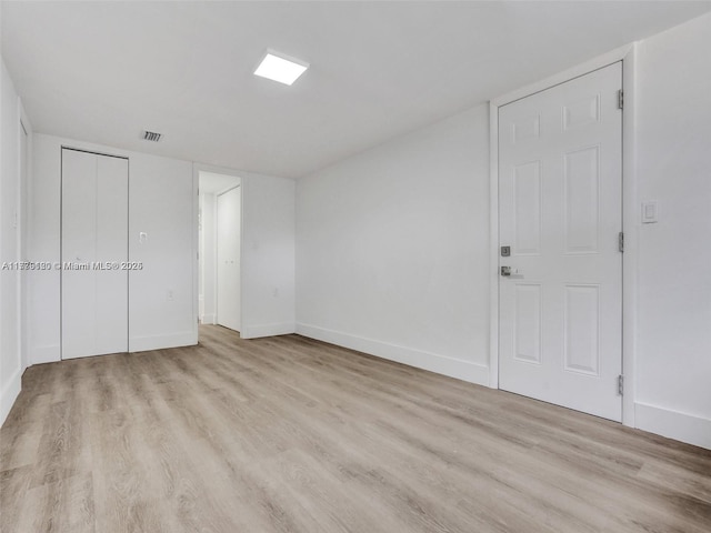 unfurnished bedroom with light hardwood / wood-style floors