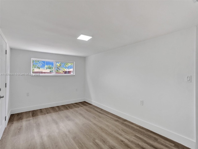 spare room with light hardwood / wood-style floors