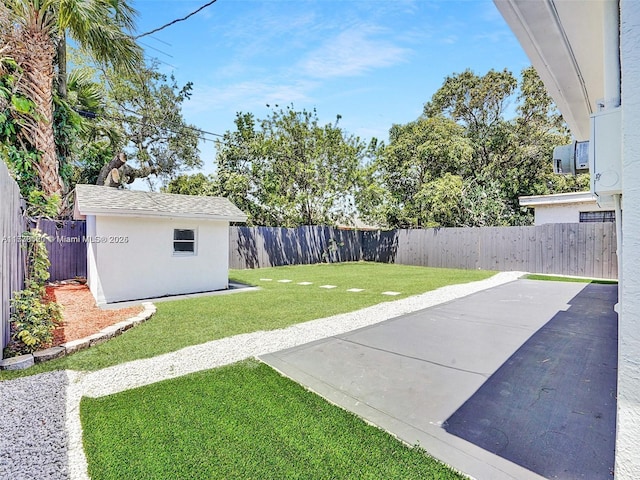 view of yard featuring an outdoor structure and a patio area