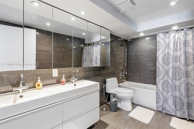 full bathroom featuring tile walls, shower / bath combination with curtain, backsplash, vanity, and toilet