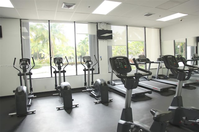 gym featuring a paneled ceiling