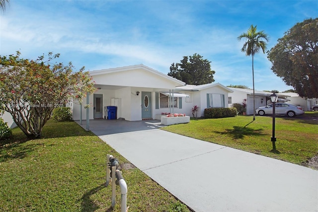 ranch-style house featuring a carport and a front yard