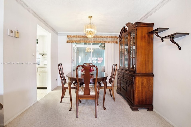 dining area with light carpet, a notable chandelier, and crown molding