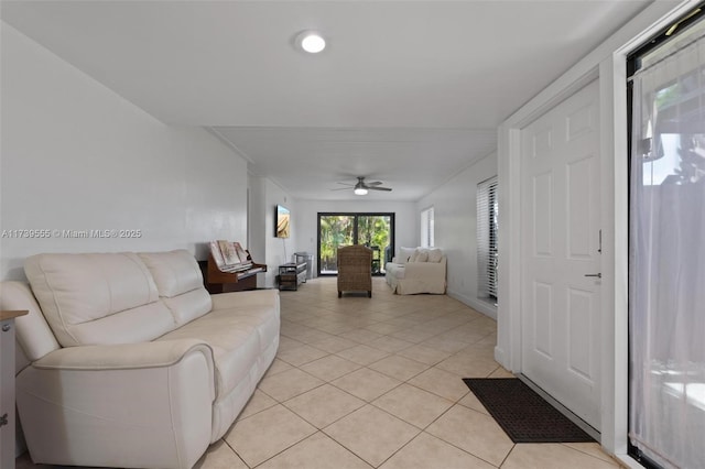 living room with light tile patterned flooring and ceiling fan