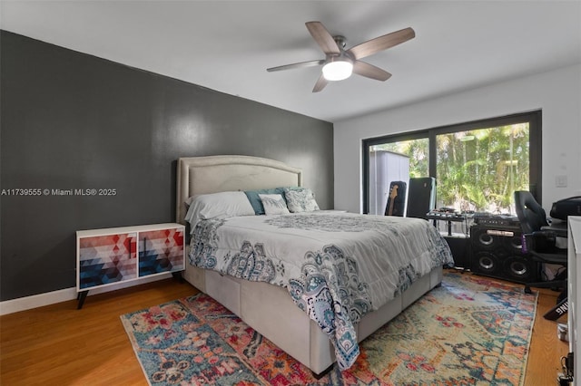 bedroom featuring ceiling fan and light hardwood / wood-style flooring