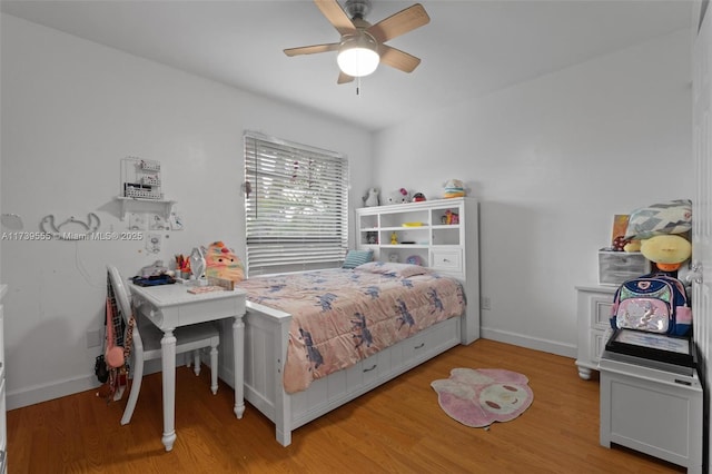 bedroom with light hardwood / wood-style flooring and ceiling fan