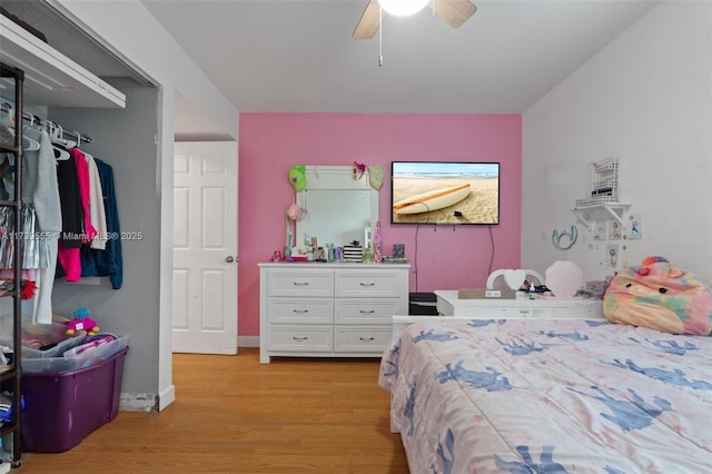 bedroom featuring ceiling fan and light hardwood / wood-style flooring