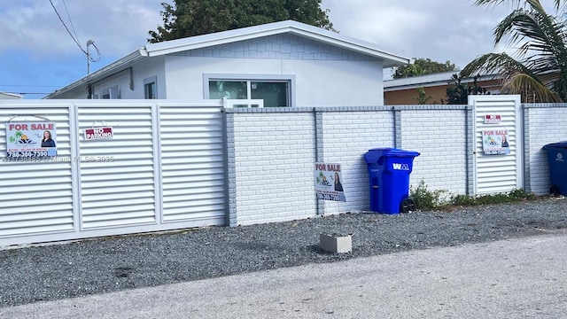 view of gate featuring fence