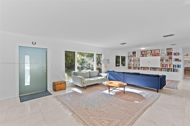 living room featuring built in shelves