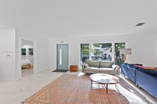 living room with light tile patterned floors