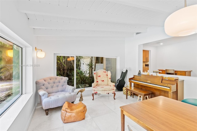 living room with beamed ceiling, wood ceiling, and light tile patterned floors