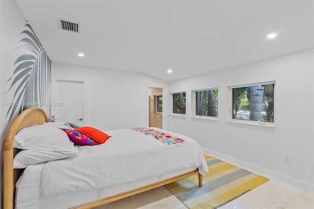 bedroom with lofted ceiling