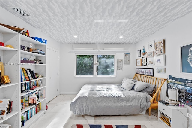 bedroom featuring a textured ceiling