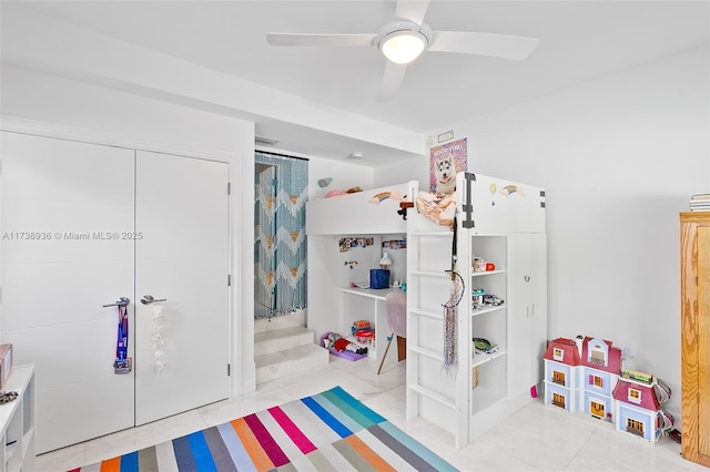 bedroom with ceiling fan and a closet