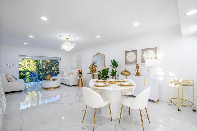 dining area featuring an inviting chandelier