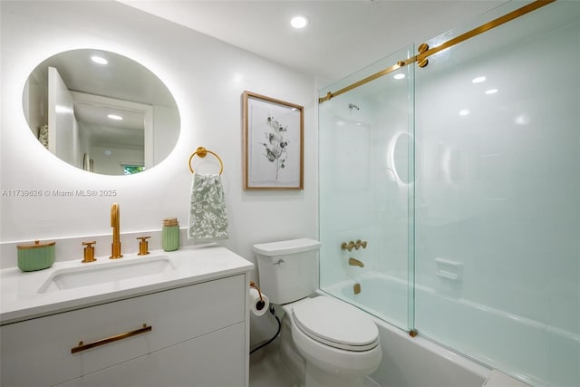 full bathroom featuring enclosed tub / shower combo, vanity, and toilet