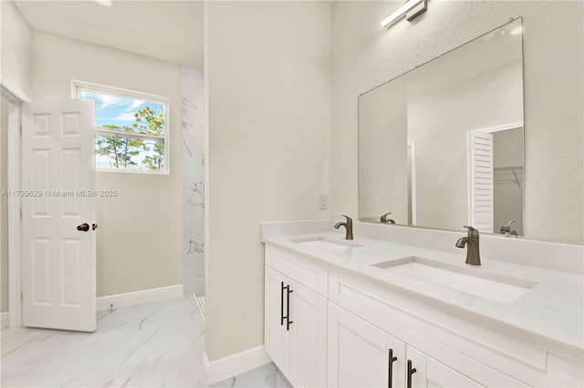 bathroom featuring vanity and a shower