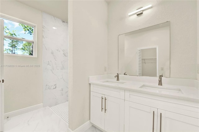 bathroom featuring vanity and a tile shower