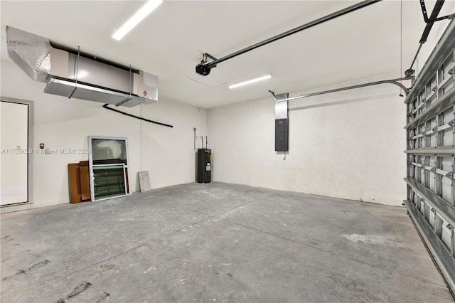 garage featuring electric panel and water heater