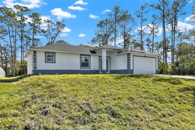 ranch-style home featuring a garage and a front lawn