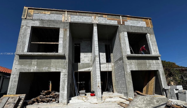 unfinished property with a fireplace