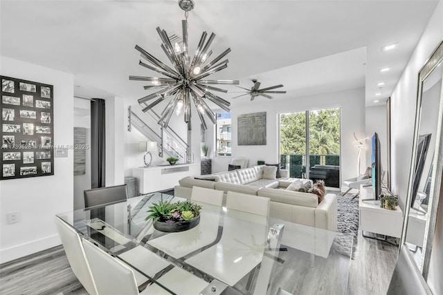 dining area featuring light hardwood / wood-style floors and a notable chandelier