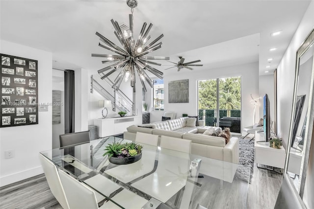 2138 Van Buren St Unit 606, Hollywood, FL 33020 - dining room featuring baseboards, light wood-type flooring, and an inviting chandelier