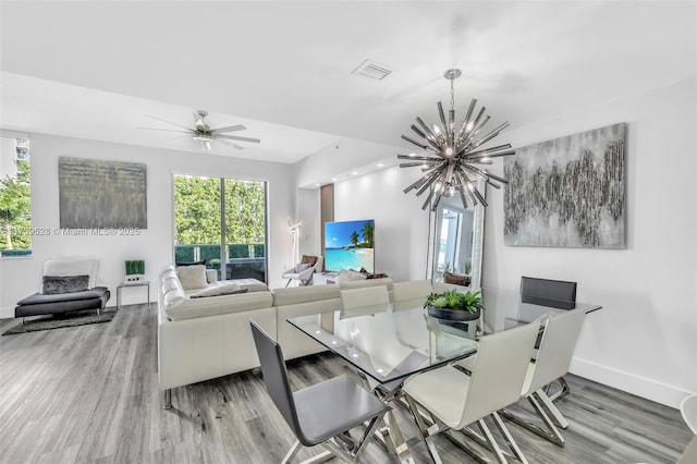2138 Van Buren St Unit 606, Hollywood, FL 33020 - dining room with baseboards, visible vents, wood finished floors, and a wealth of natural light