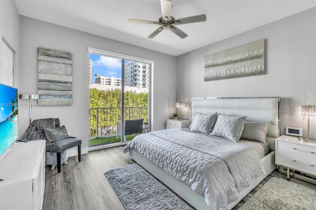 bedroom with ceiling fan and light hardwood / wood-style flooring