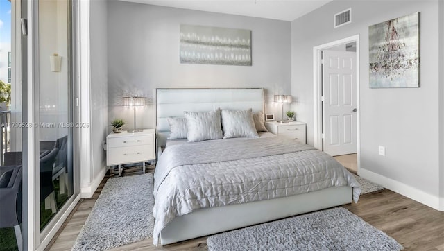 bedroom with light hardwood / wood-style floors