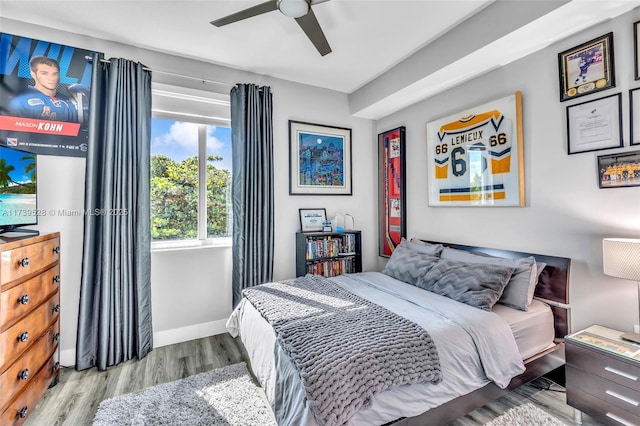 bedroom featuring light hardwood / wood-style floors and ceiling fan