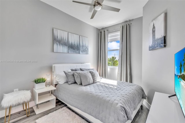 bedroom with hardwood / wood-style flooring and ceiling fan