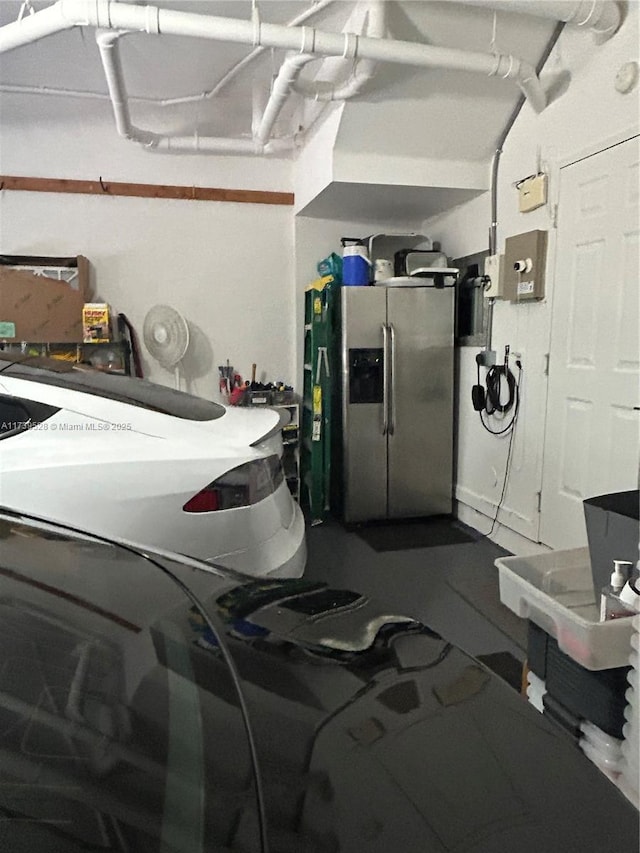 garage featuring stainless steel fridge