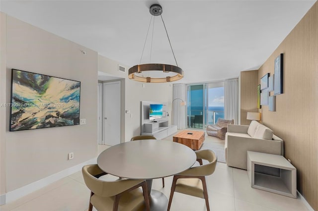 tiled dining area with expansive windows