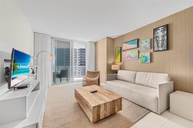 living room with light colored carpet and floor to ceiling windows