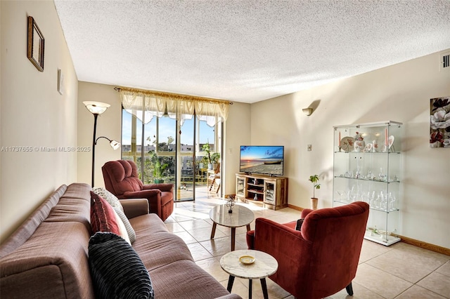 living room with light tile patterned floors and a textured ceiling