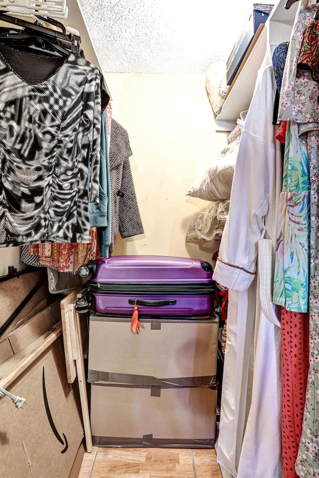 spacious closet featuring light hardwood / wood-style floors