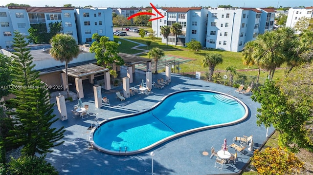 view of swimming pool featuring a patio area