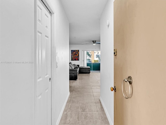 16900 NE 14th Ave Unit 115, Miami, FL 33162 - hall with baseboards and light tile patterned flooring