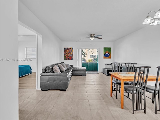 dining room with light tile patterned floors and a ceiling fan