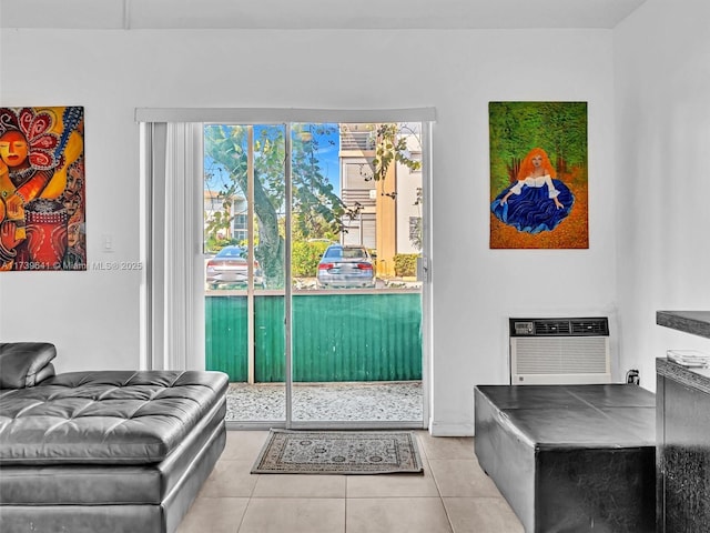 doorway featuring a wall mounted AC and tile patterned floors