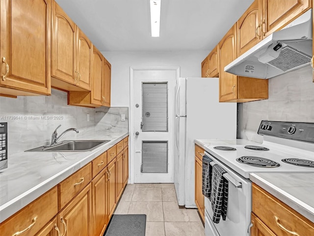 kitchen featuring light countertops, white electric range, light tile patterned flooring, a sink, and under cabinet range hood