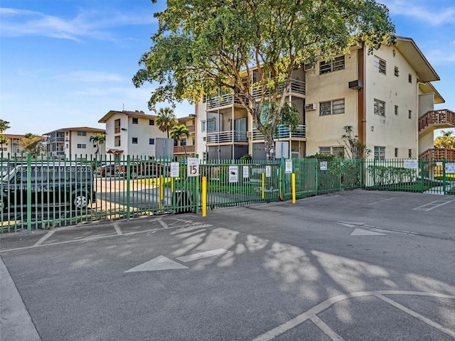 view of street with a residential view and a gated entry