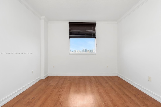 unfurnished room with crown molding and light wood-type flooring