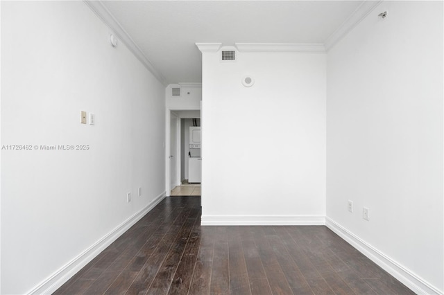 unfurnished room with crown molding and dark wood-type flooring