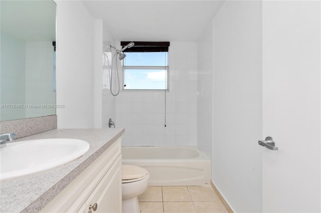 full bathroom featuring tiled shower / bath, tile patterned floors, toilet, and vanity