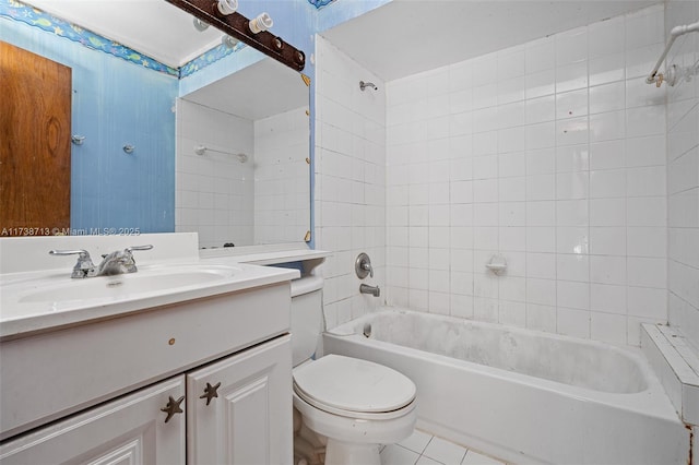 full bathroom with vanity, tiled shower / bath combo, tile patterned floors, and toilet