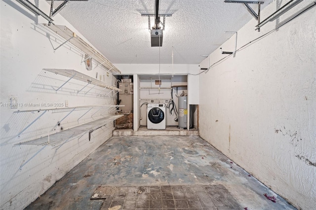 garage featuring washer / clothes dryer, a garage door opener, and electric water heater