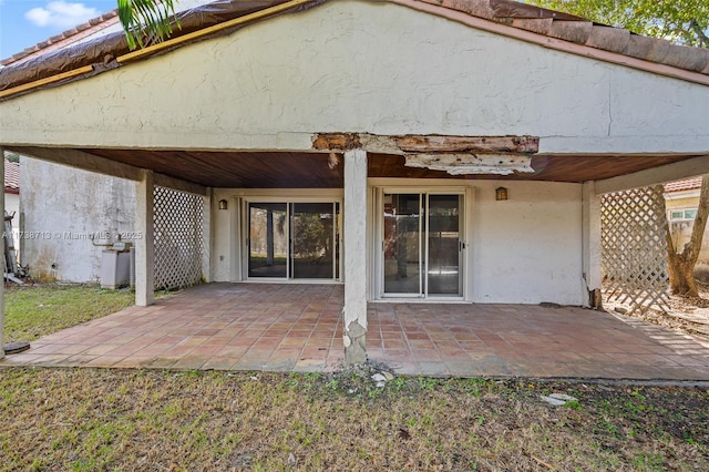 rear view of property featuring a patio