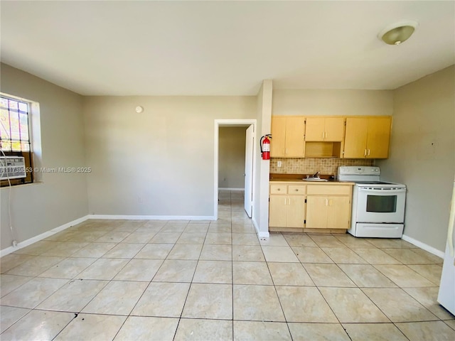 kitchen with white electric range, light brown cabinetry, sink, backsplash, and light tile patterned floors